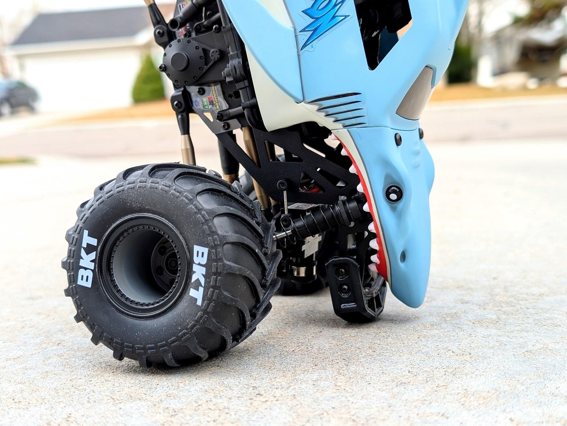 Mini Megalodon doing a nose wheelie with a front bumper protecting the nose
